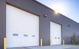 FactorySteelOverstock gray steel building with 2 overhead doors FactorySteelOverstock gray steel building with 2 overhead doors